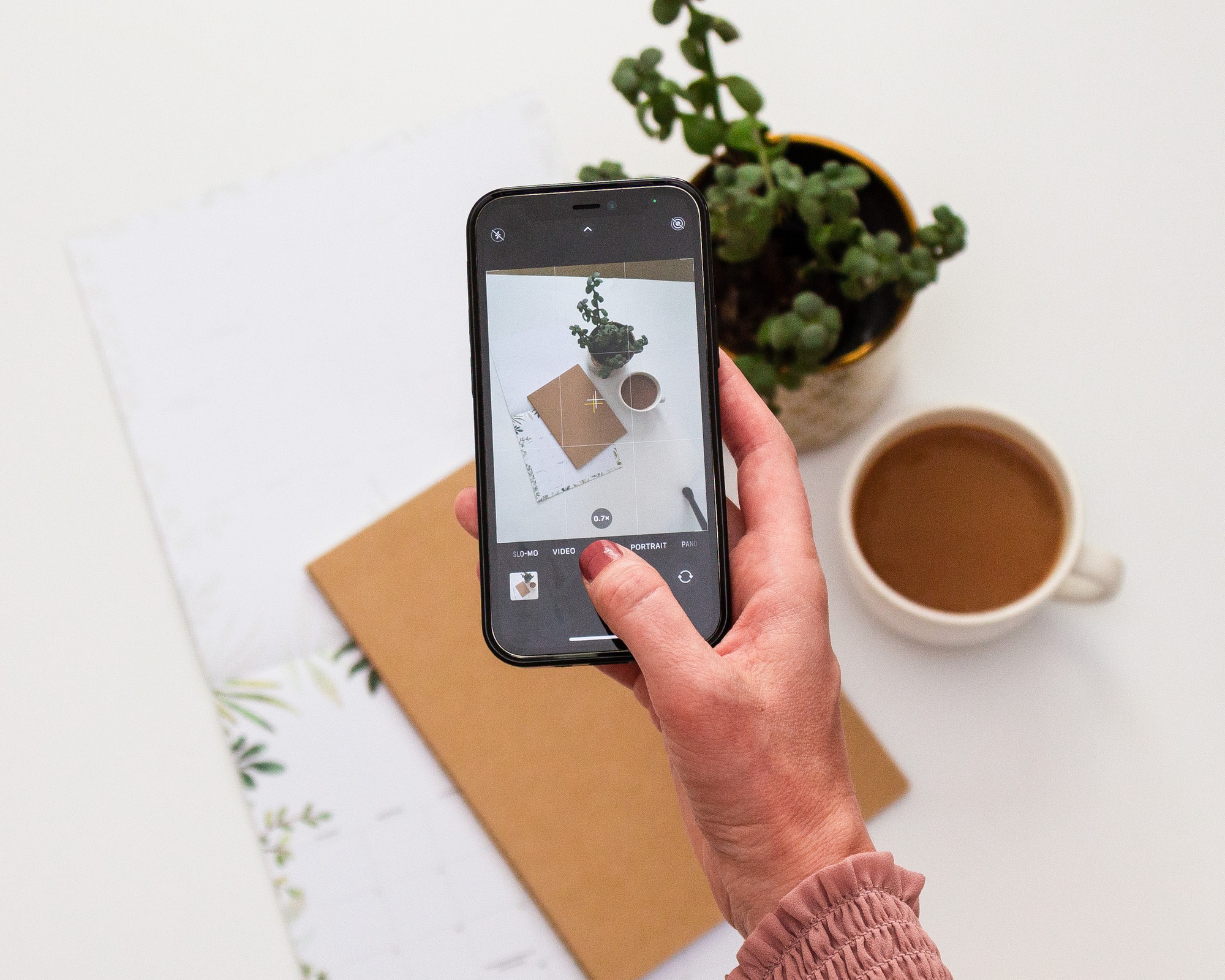 Woman influencer taking a photo for social media