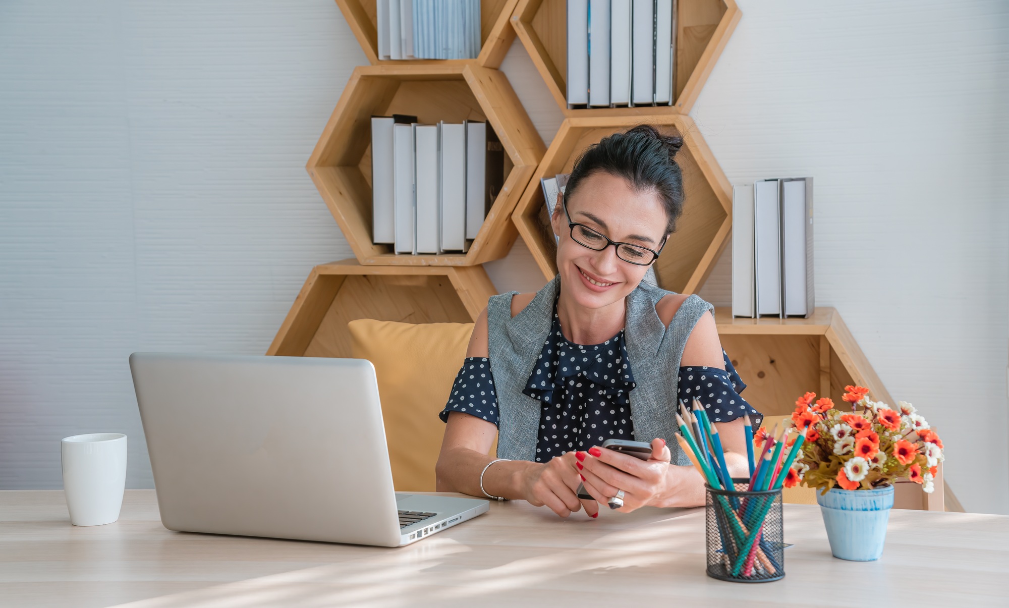 Beautiful Confident young business woman thinking work with laptop computer and document file on des